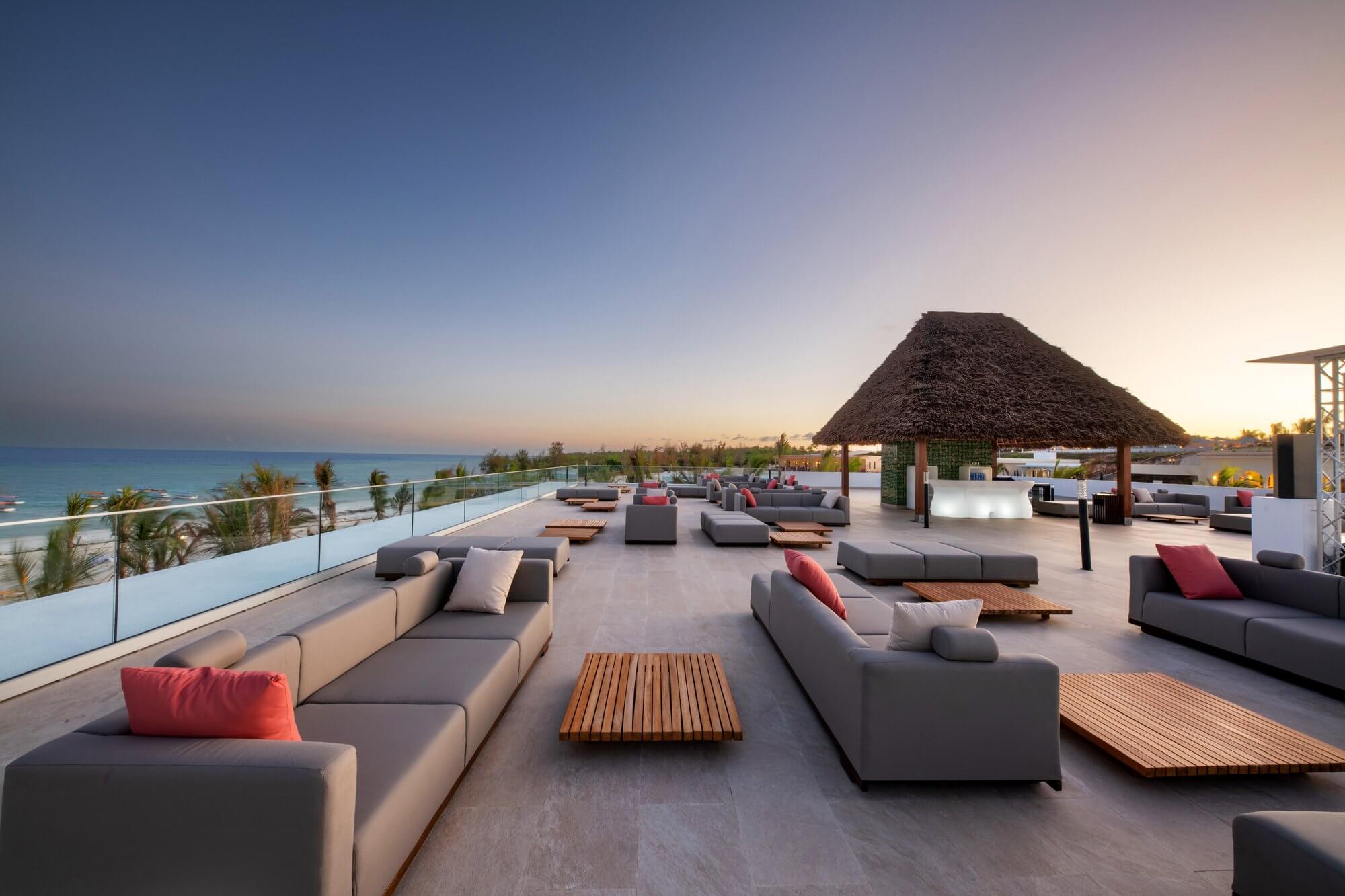 12-Day Premium Luxury Safari & Beach Holidayznz012024_-ac132612097_tm_zanzibar_the-mora-zanzibar_Muyuni_Beach_Club_lounge_sunset-1-1.jpg