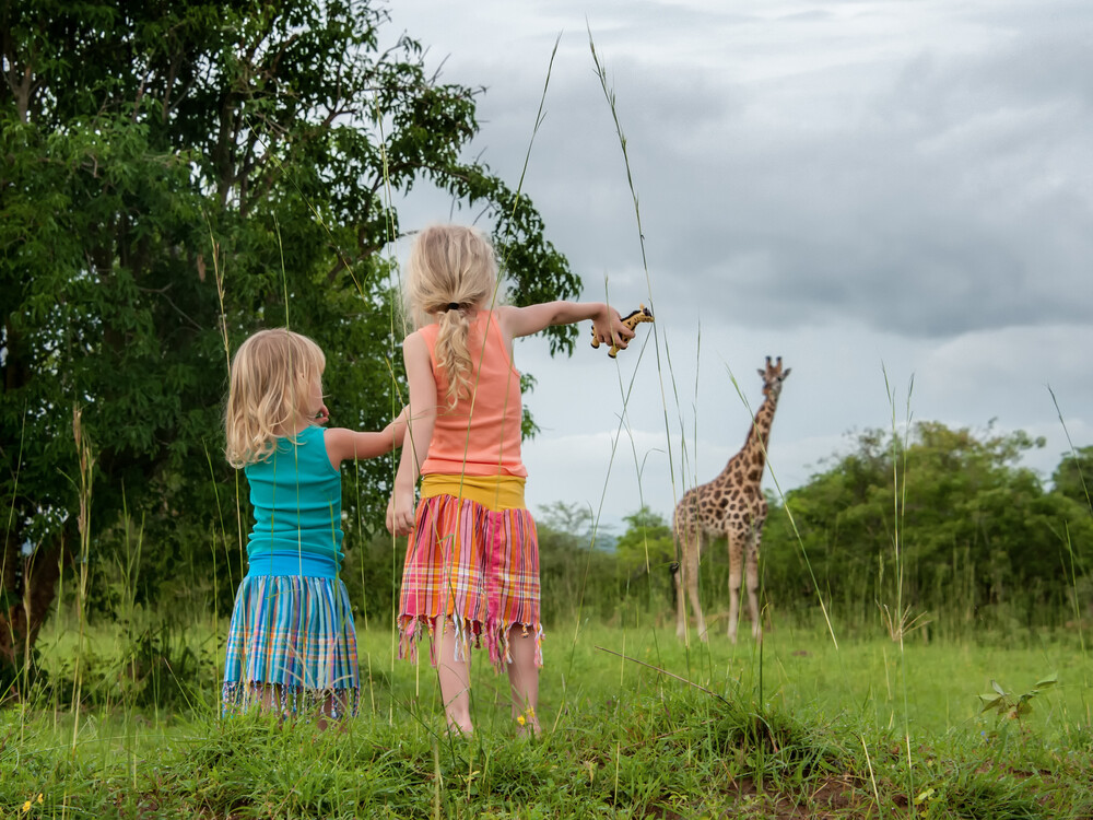Little,Girls,Showing,The,Giraffe,Their,Giraffe,Toys,,Murchison,Falls
